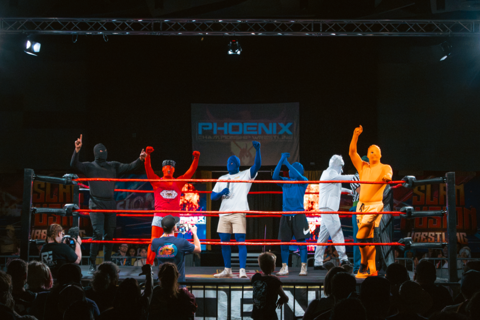 Full roster lined up in the ring